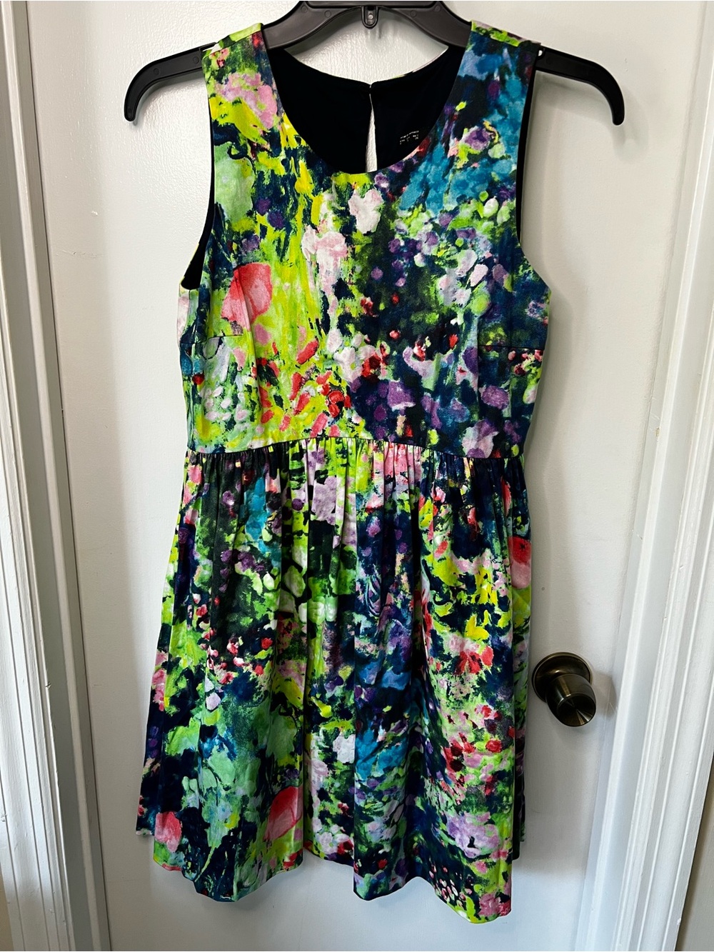 Zara Sleeveless Dress with vibrant watercolor floral print.
